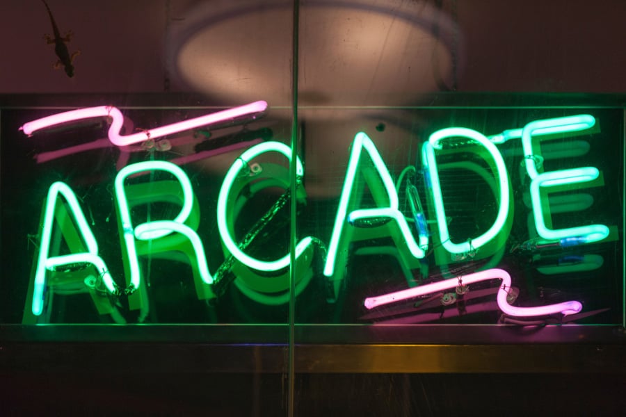 Illuminated green neon ARCADE sign — Rick Signs vintage neon repair and restoration Chicago