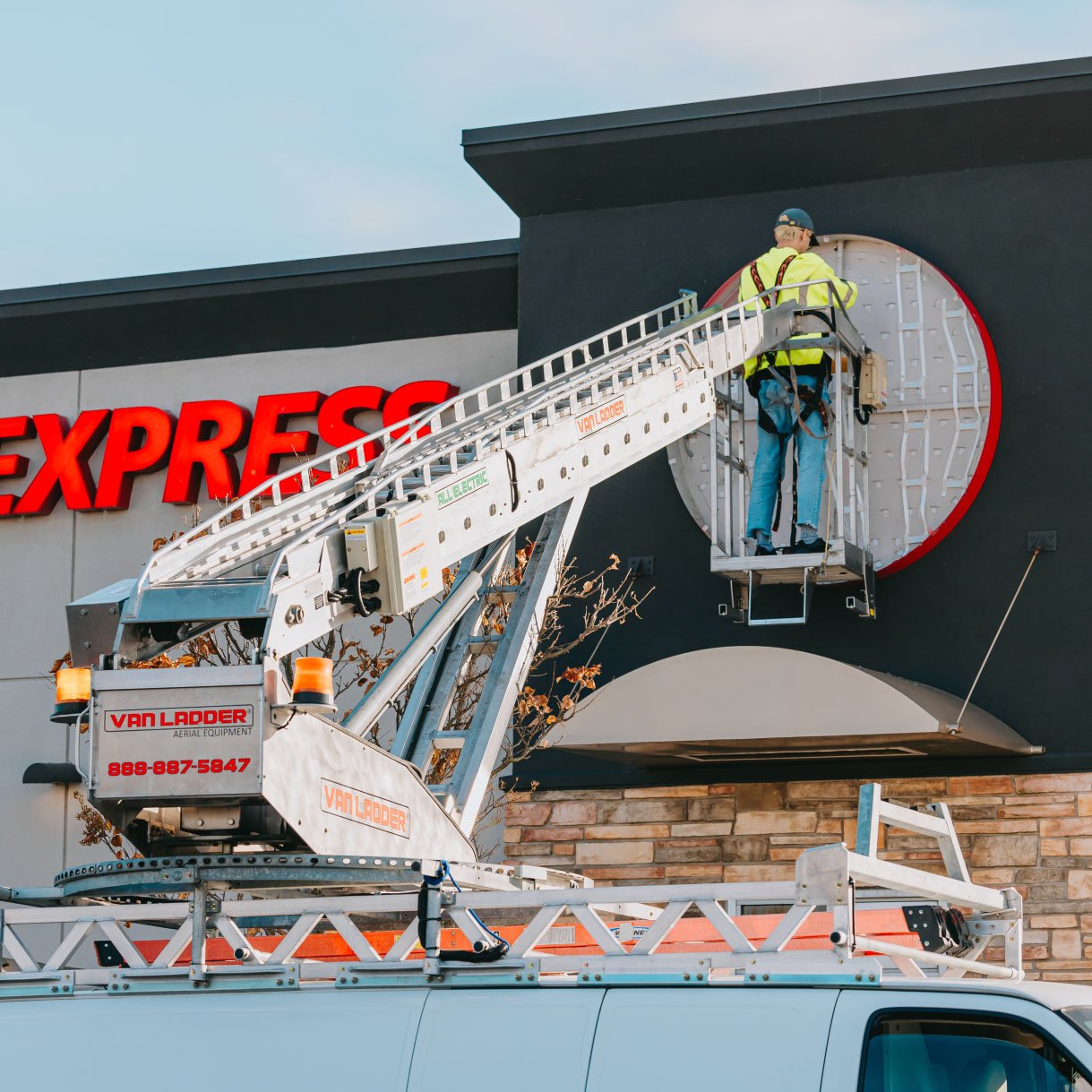 Close-up of the Panda Express EXPRESS channel letters with Rick Signs bucket truck during a Chicago repair