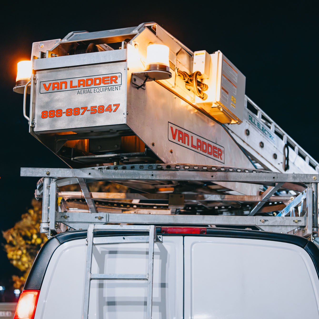 Close-up of the Rick Signs Van Ladder bucket truck aerial equipment used for tall sign repair in Chicago