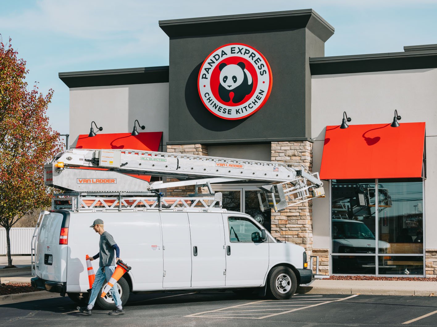 Panda Express restaurant exterior with Rick Signs bucket truck during a storefront sign service call in Chicago