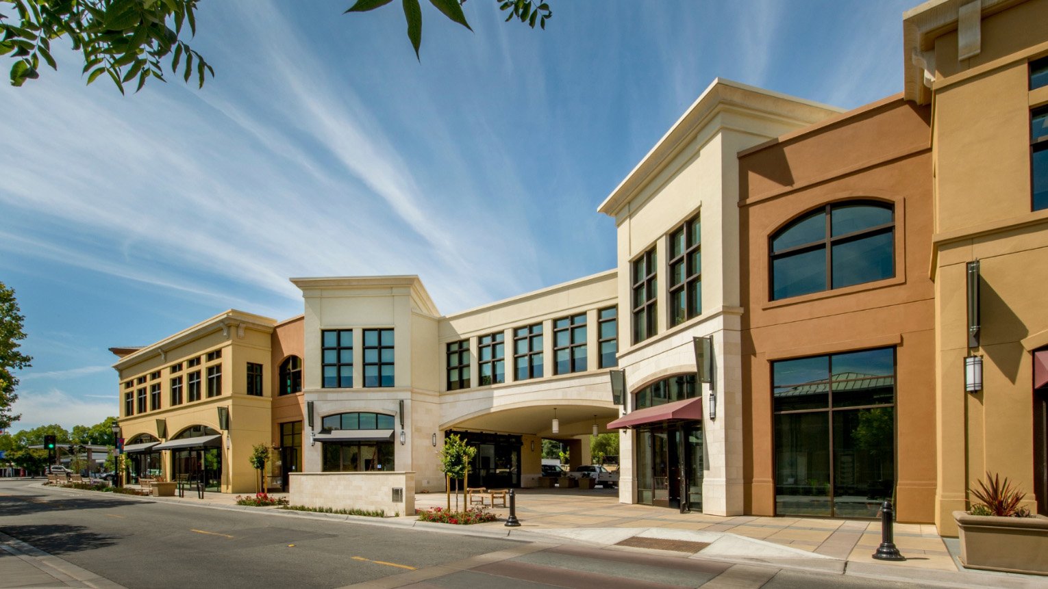 Multi-tenant commercial property with storefront signage — sign and lighting vendor services for Chicago property managers