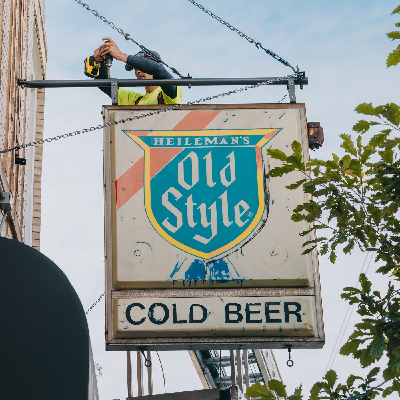 The finished Heileman's Old Style Cold Beer projecting sign hanging square above the Empty Bottle entrance in Chicago