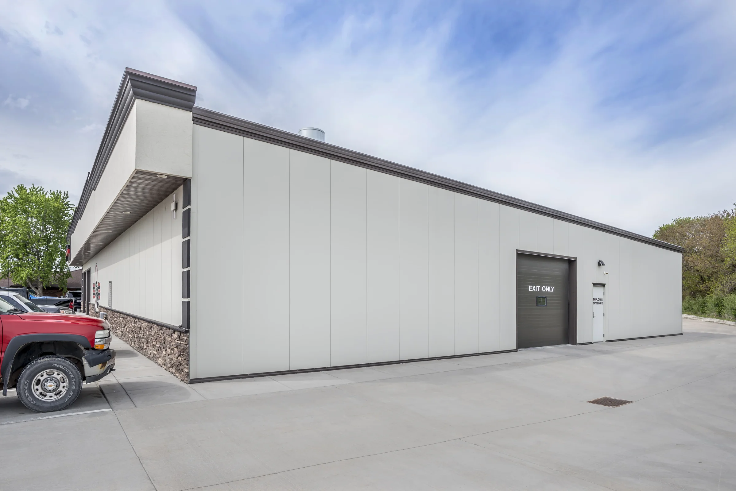 Side exterior of the Crash Champions collision repair building