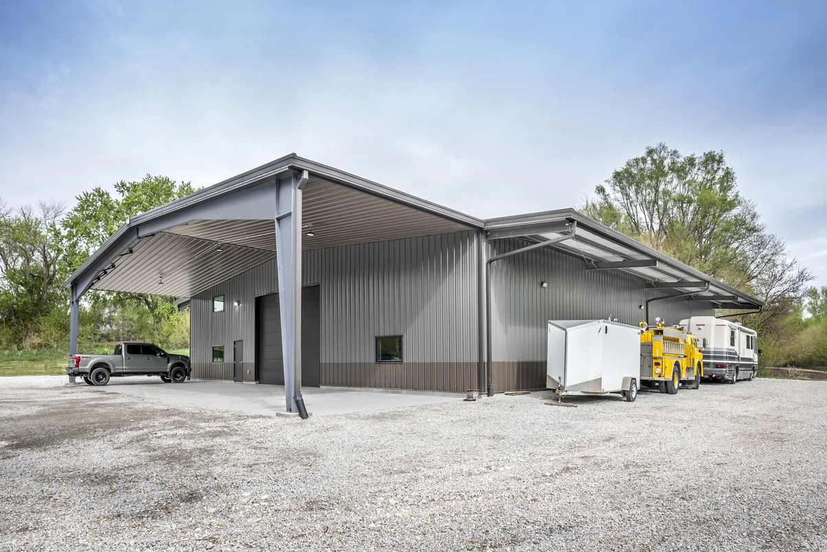 Corner canopy vehicle storage area at the South Farm steel shop building