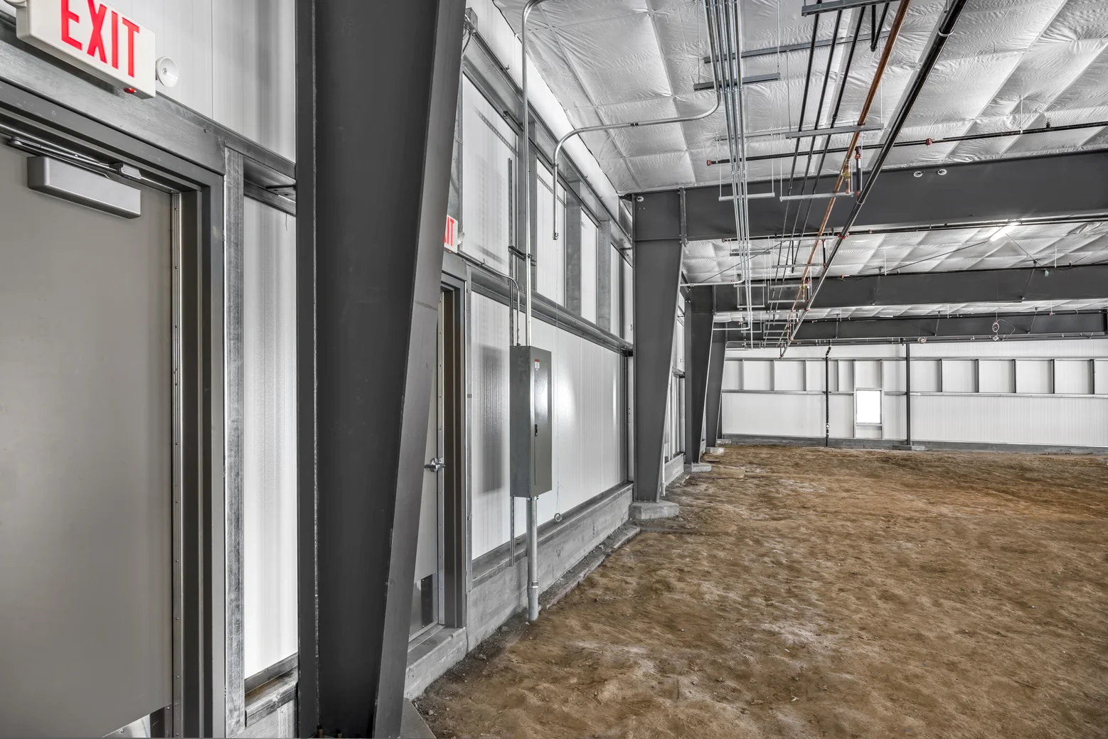 Interior exit door and steel framing in a commercial unit at the I-Mark project