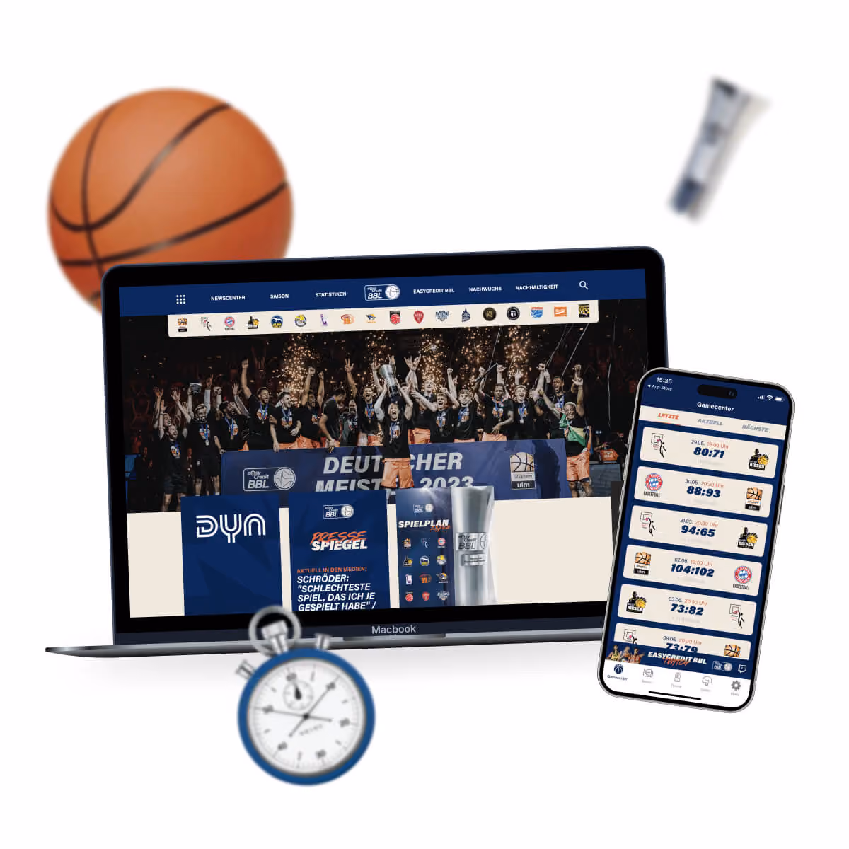 Laptop zeigt Basketball-Meisterfeier 2023, daneben Handy mit Spielergebnissen und Basketball, Stoppuhr, Tube.
