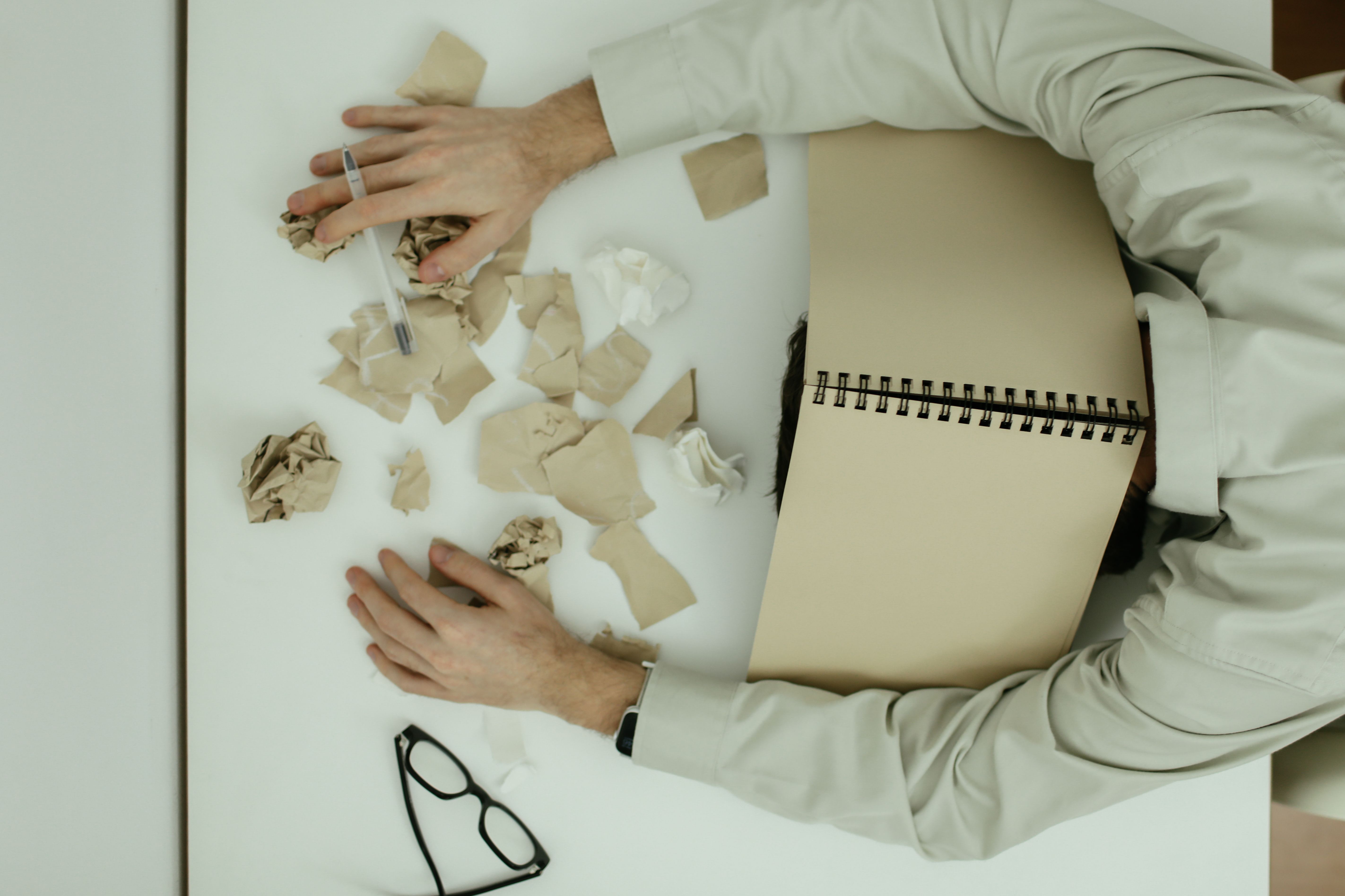 Team member appearing overloaded, illustrating resource burnout risk