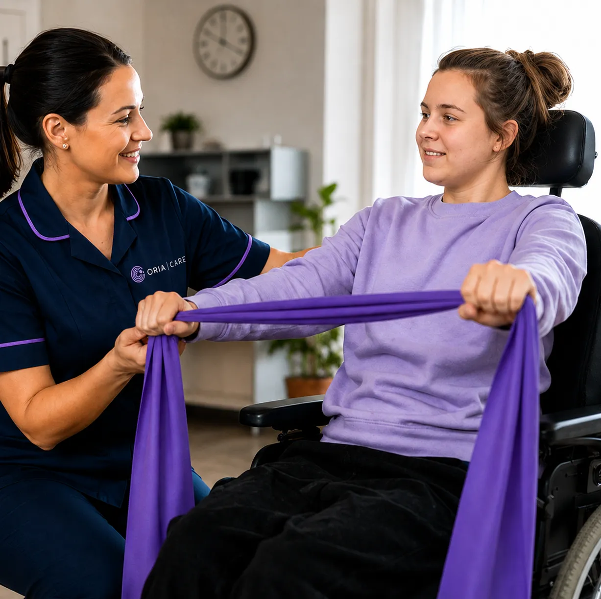 Therapist assists woman in wheelchair stretching purple resistance band in bright room.