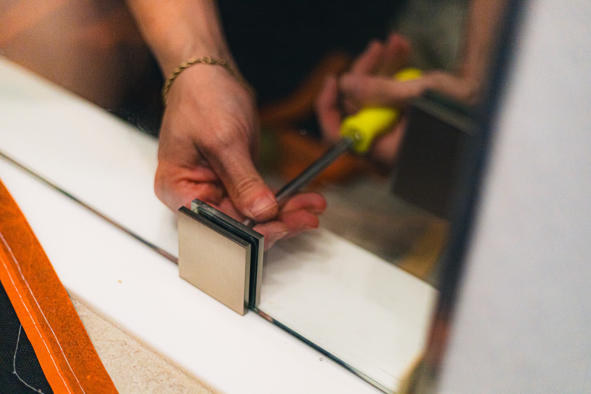 Total Shower Glass technicians preparing a bathroom for frameless shower glass installation
