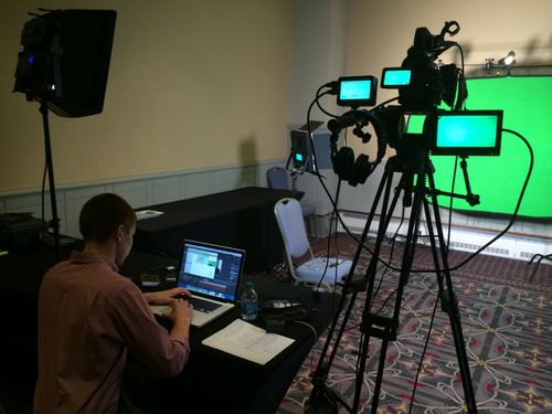 Green screen video production setup with camera, monitors, and lighting from the 2014 AERA project