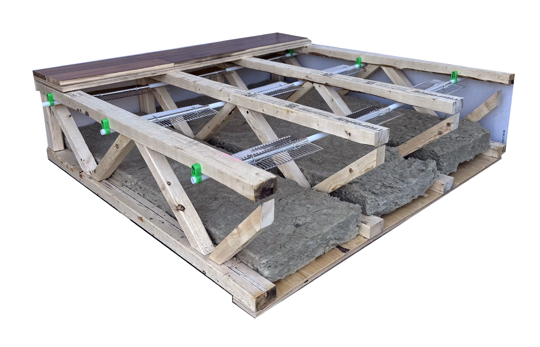 Wooden frame structure with insulation material installed between beams under partial flooring.