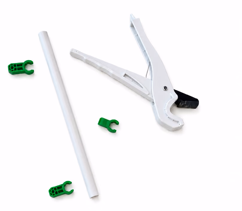 White pipe cutter tool with a white pipe and four small green pipe clips on a white background.