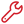 Red wrench icon with an open jaw and handle.