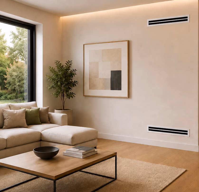 Modern living room with beige sectional sofa, wooden coffee table, potted plant, and abstract wall art.