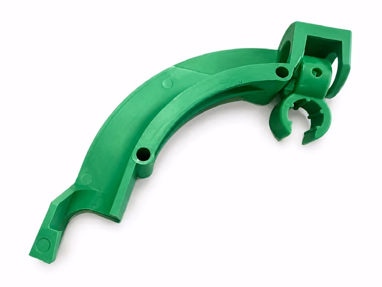 Curved green plastic component with mounting holes and a clamp-like structure on a white background.