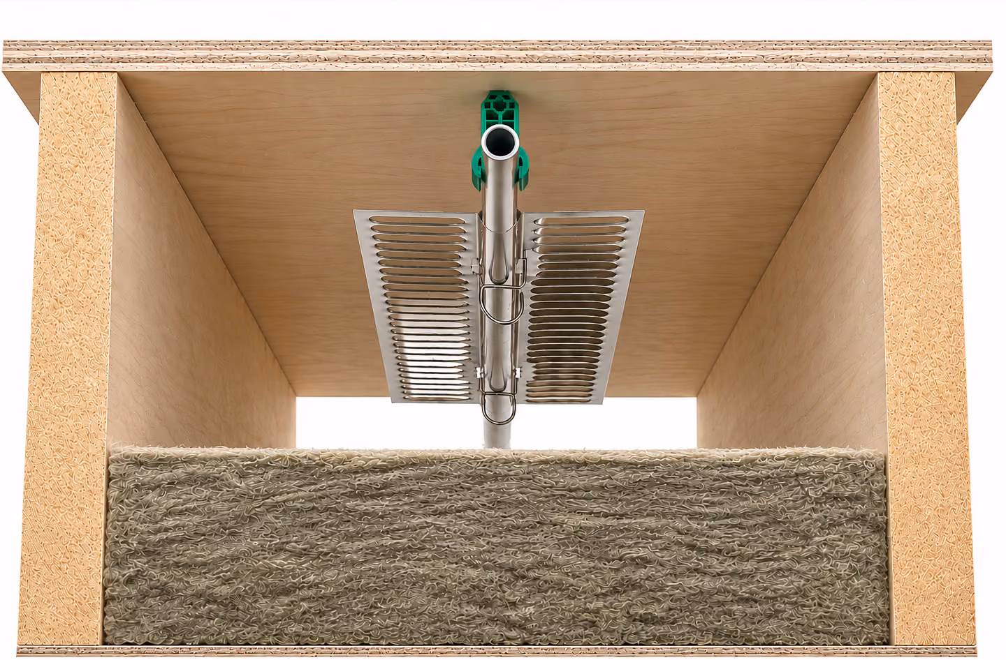 Close-up of a metal pipe and vent panel inside a wooden housing with insulation material.