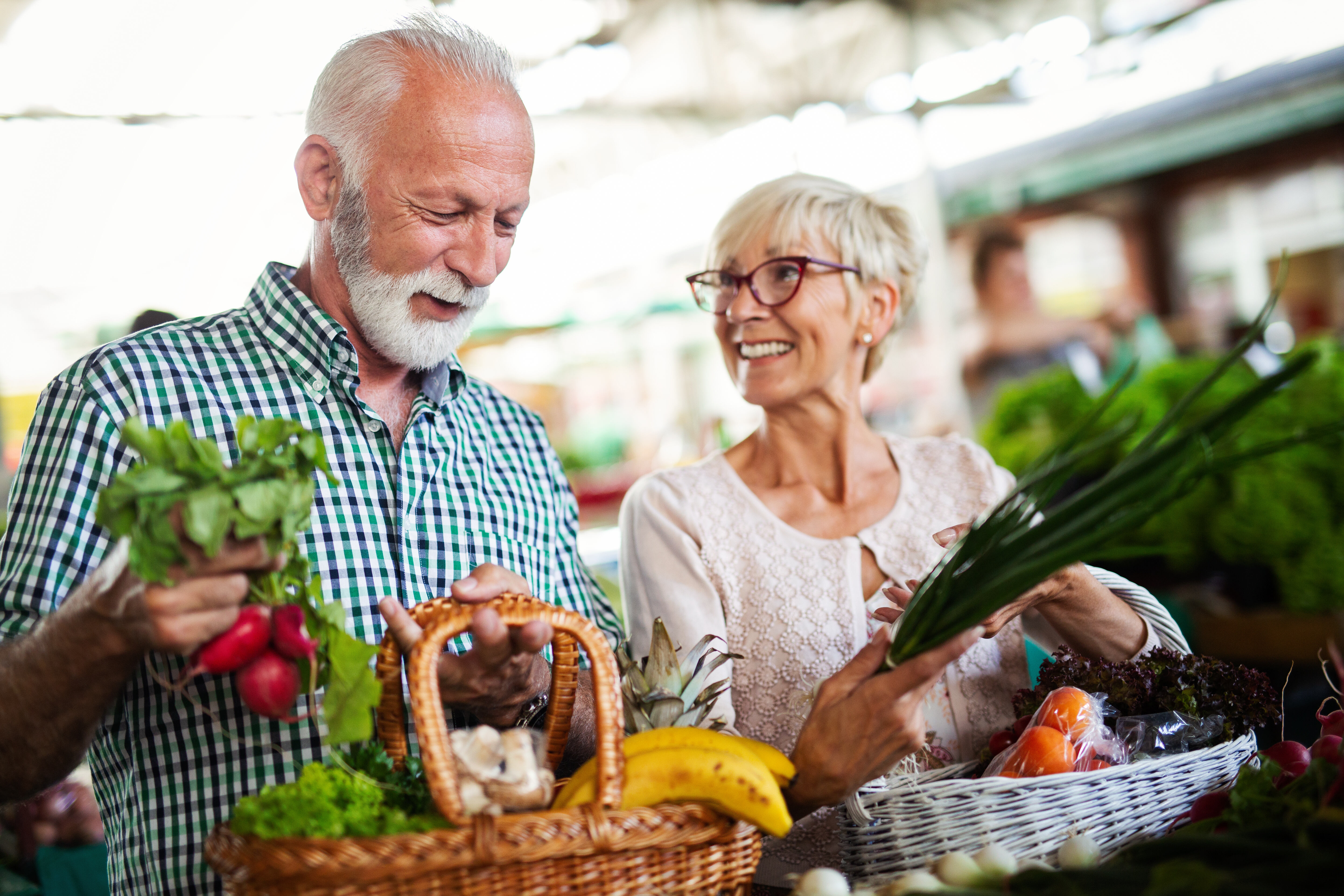 Man and woman in grocery store stock image