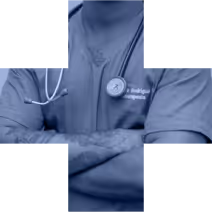 Medical professional in scrubs with arms crossed and stethoscope around neck.