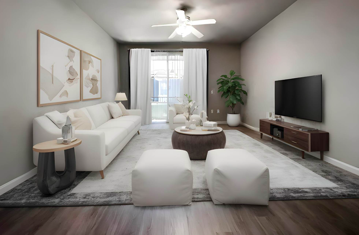 Living room with ceiling fan and sliding glass doors to balcony.