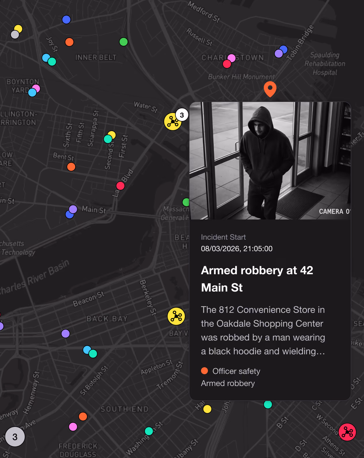 Map with colored pins and alert box showing armed robbery report featuring suspect in black hoodie.