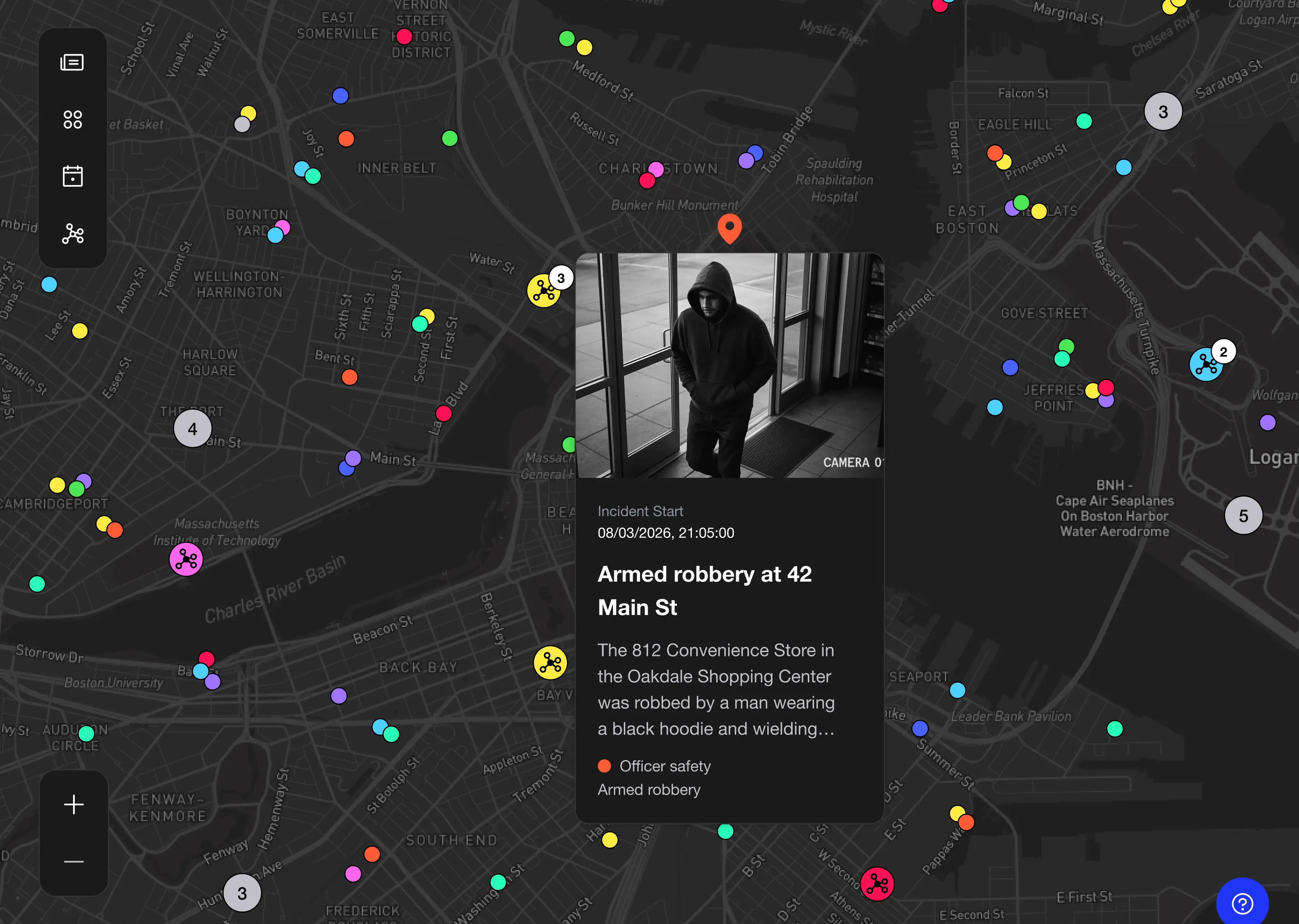 Dashboard map showing colorful location markers and a security camera feed of a hooded figure inside a building.