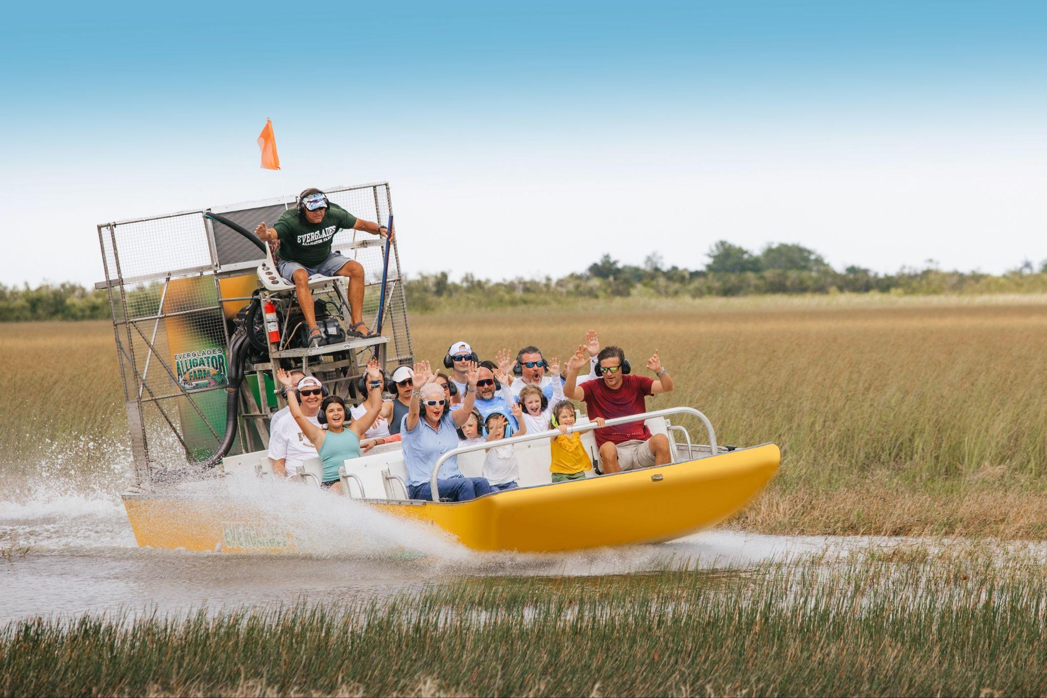 Airboat full of guests spinning through the sawgrass at Everglades Alligator Farm