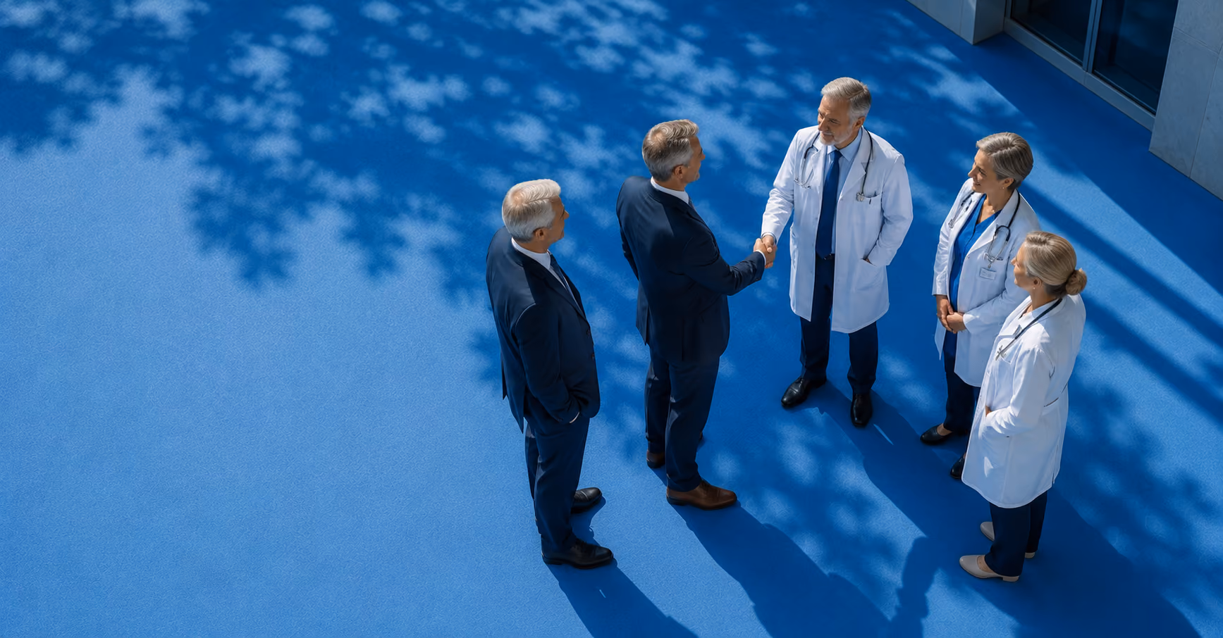 Doctors and businessmans handshaking