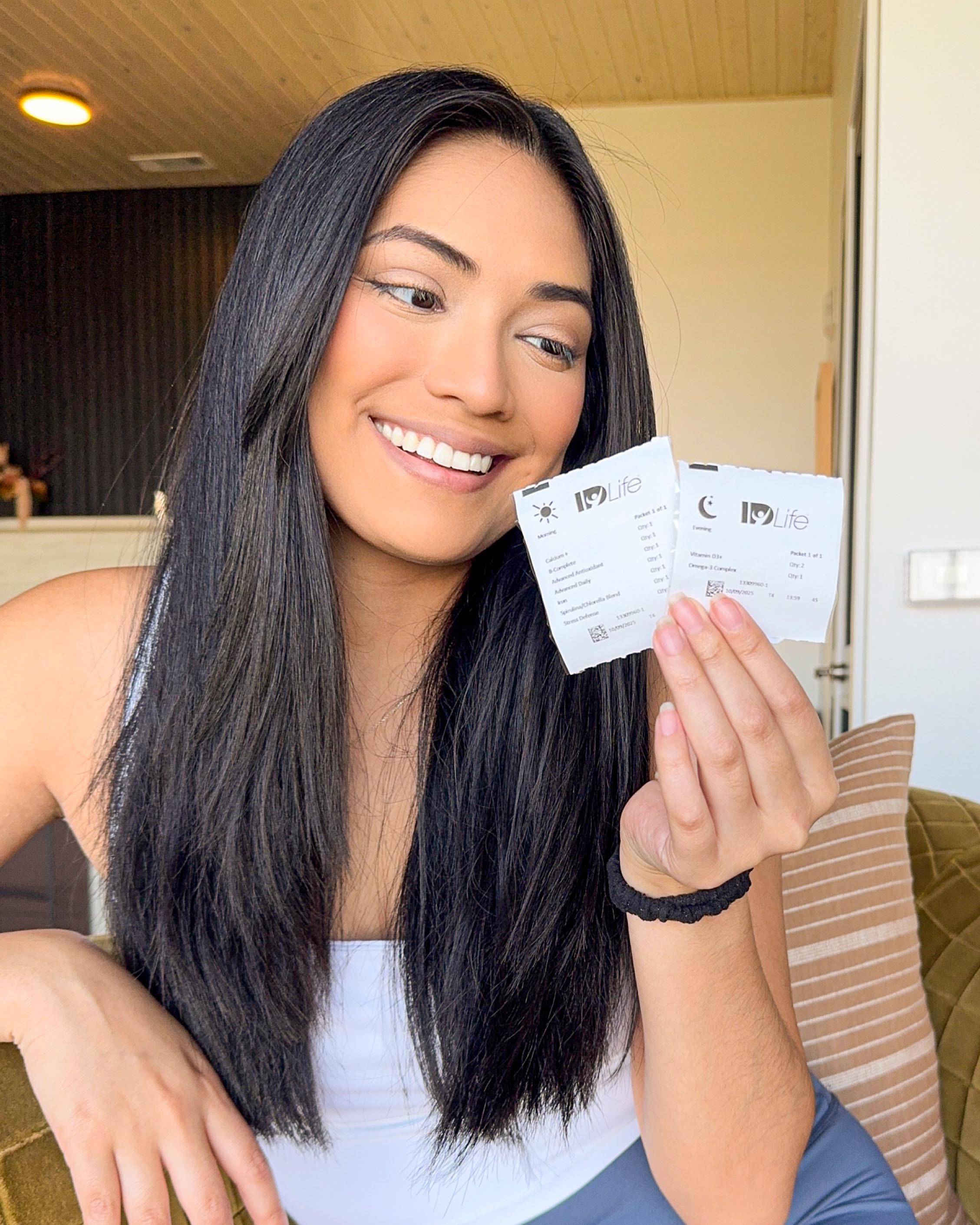 A customer's two IDNutrition packets, morning and evening, each printed with her name and the formulas inside