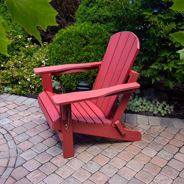 Square red wooden side table with a slatted top and lower shelf on four legs.