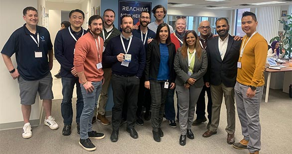 Veoci employees gathered in the Veoci offices.