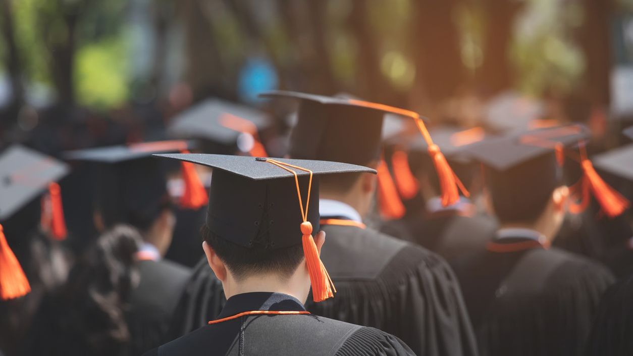 Students gathered together for a commencement ceremony.