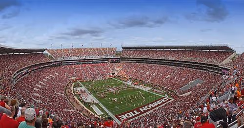 A football stadium packed with fans on game day.