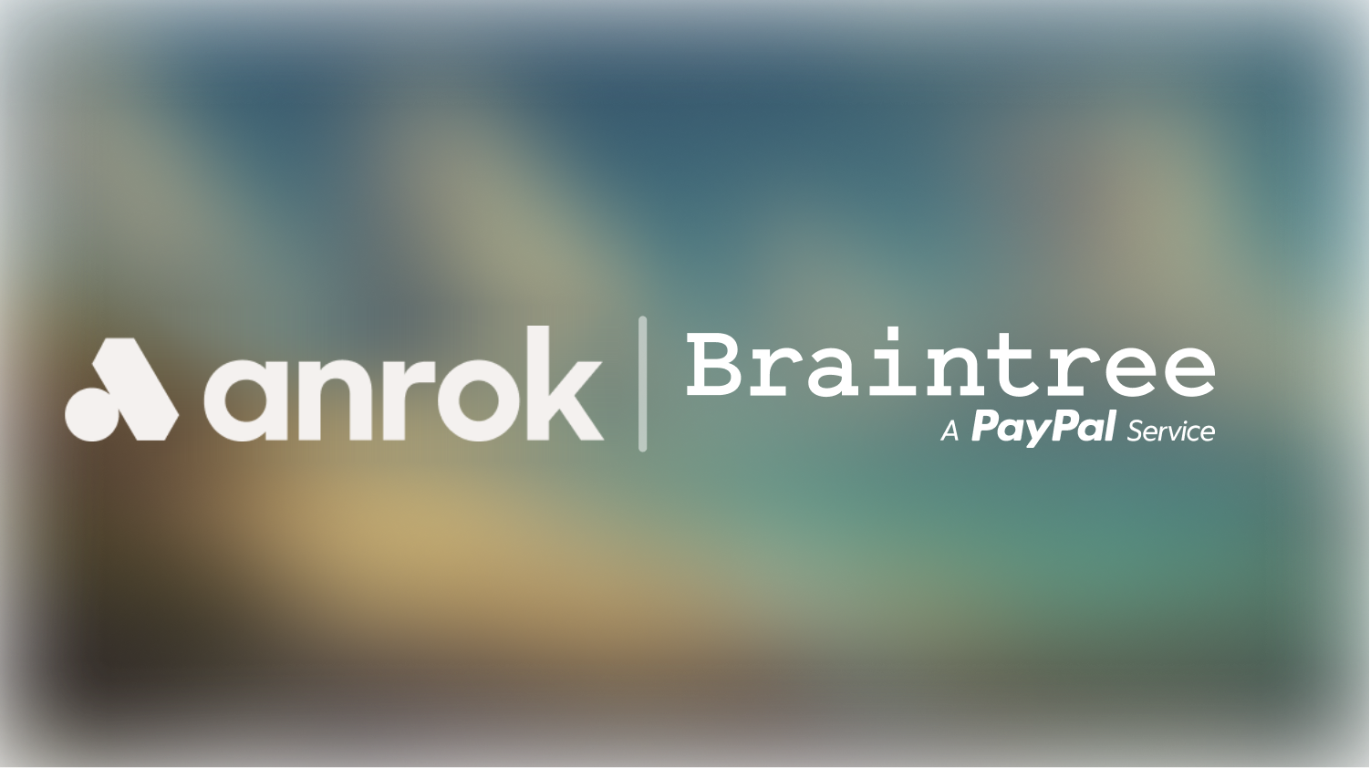 Anrok logo to the left and Braintree, a PayPal service, text to the right on a blurred background.