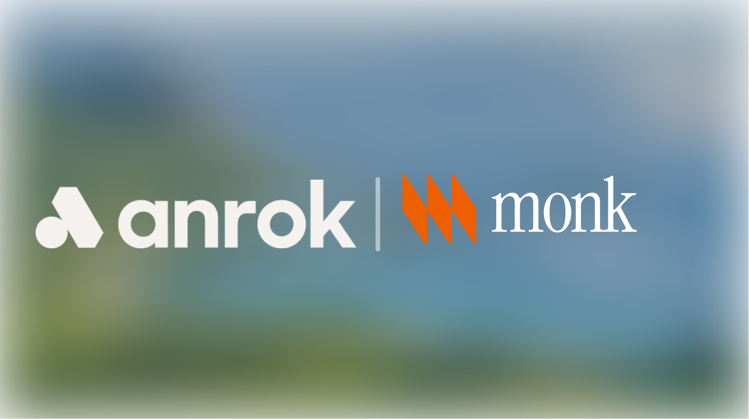 Anrok logo in white with a triangular shape, a separator, and the Monk logo in orange with text.