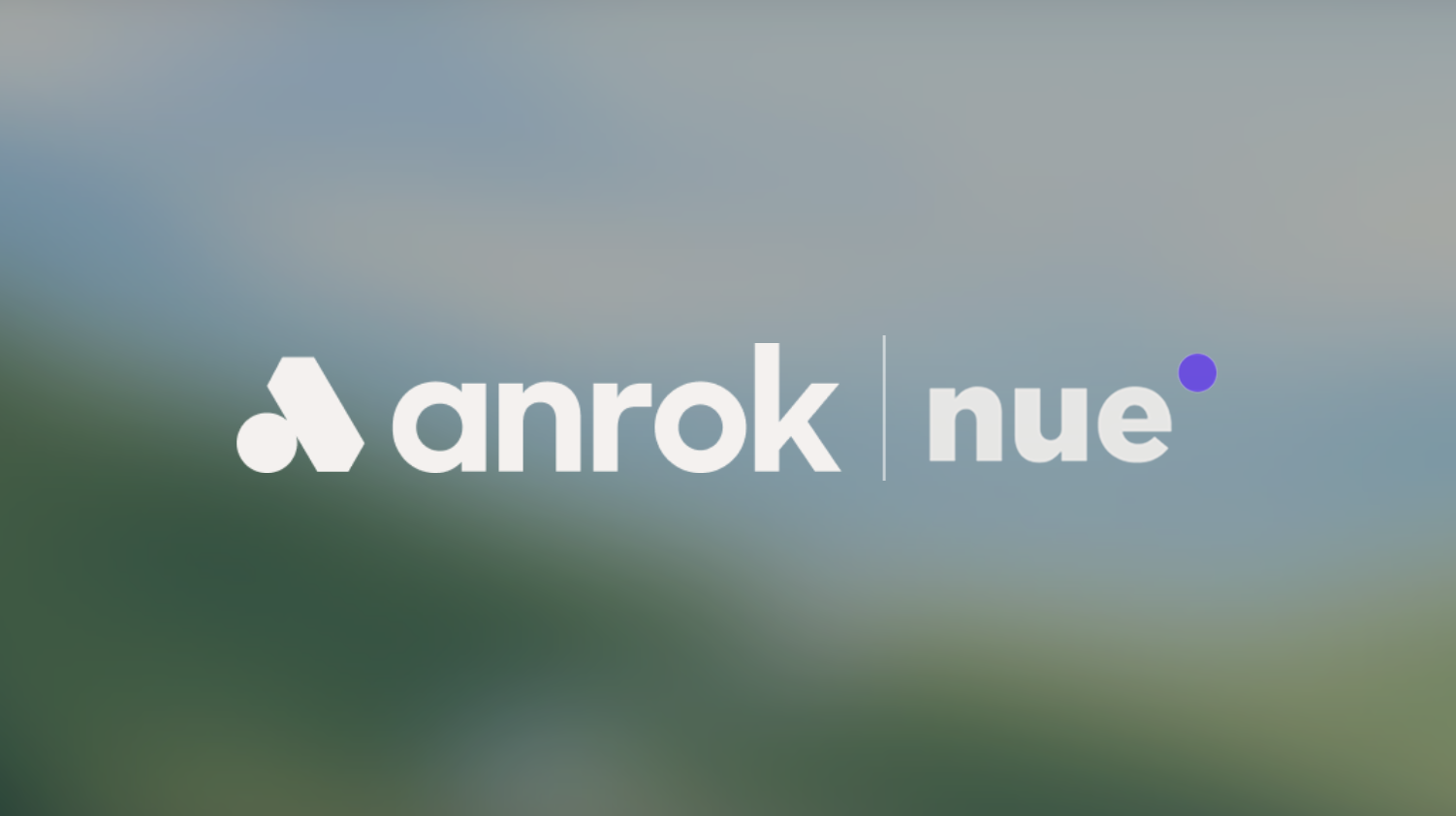 White Anrok Nue logo with stylized icon and a vertical line on a blurred blue-green background.