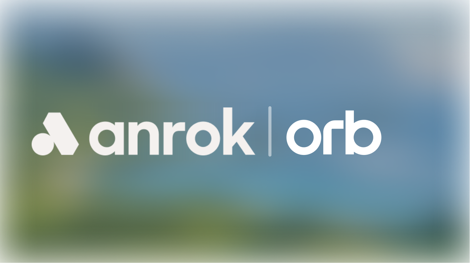 Anrok Orb logo with a stylized symbol to the left of the text on a blurred background.
