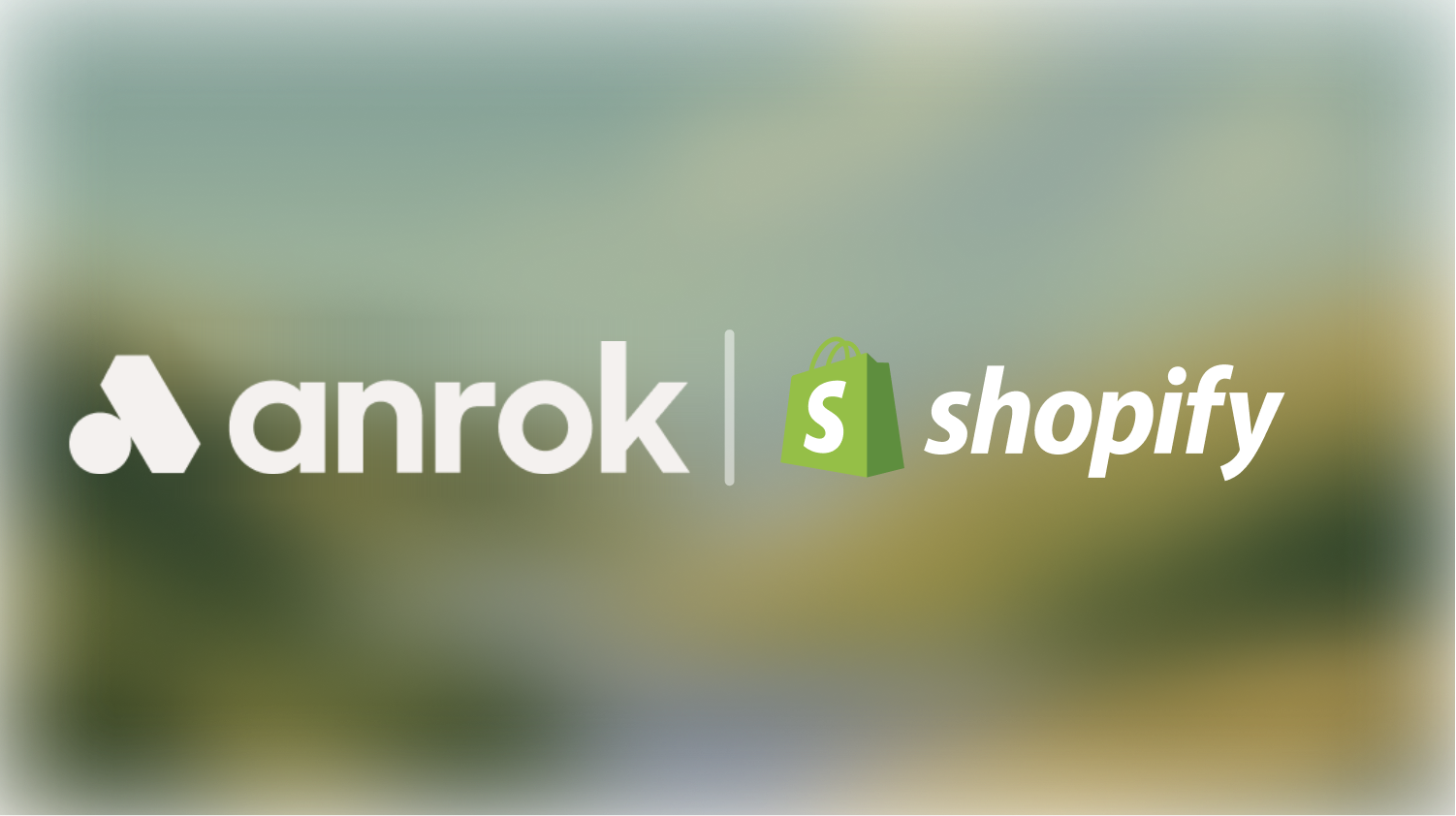 Anrok logo next to Shopify logo with shopping bag icon on blurred background.