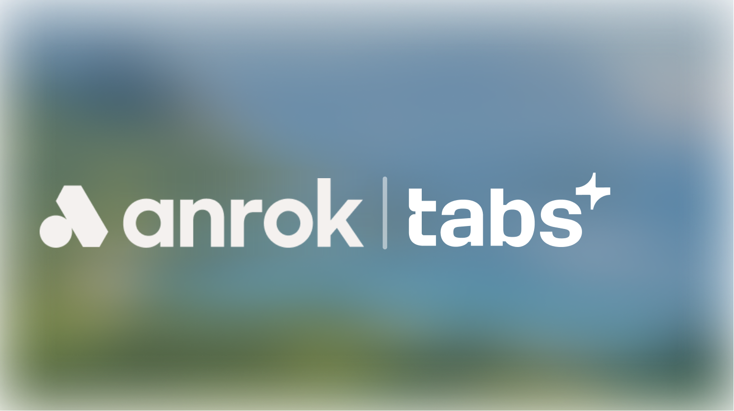 Anrok tabs brand logo with geometric symbol and sparkling star icon on blurred background.