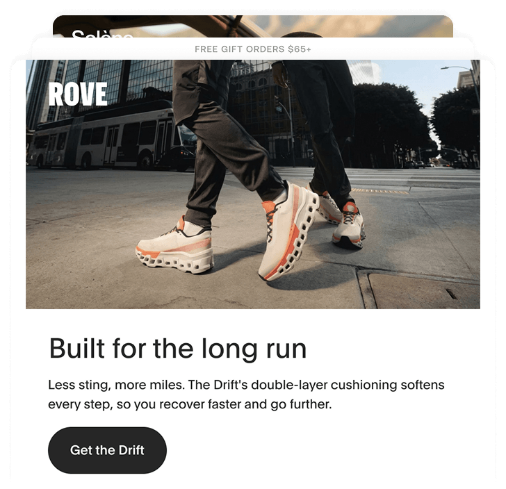 Two people walking on city street wearing white and orange ROVE Drift cushioned shoes.