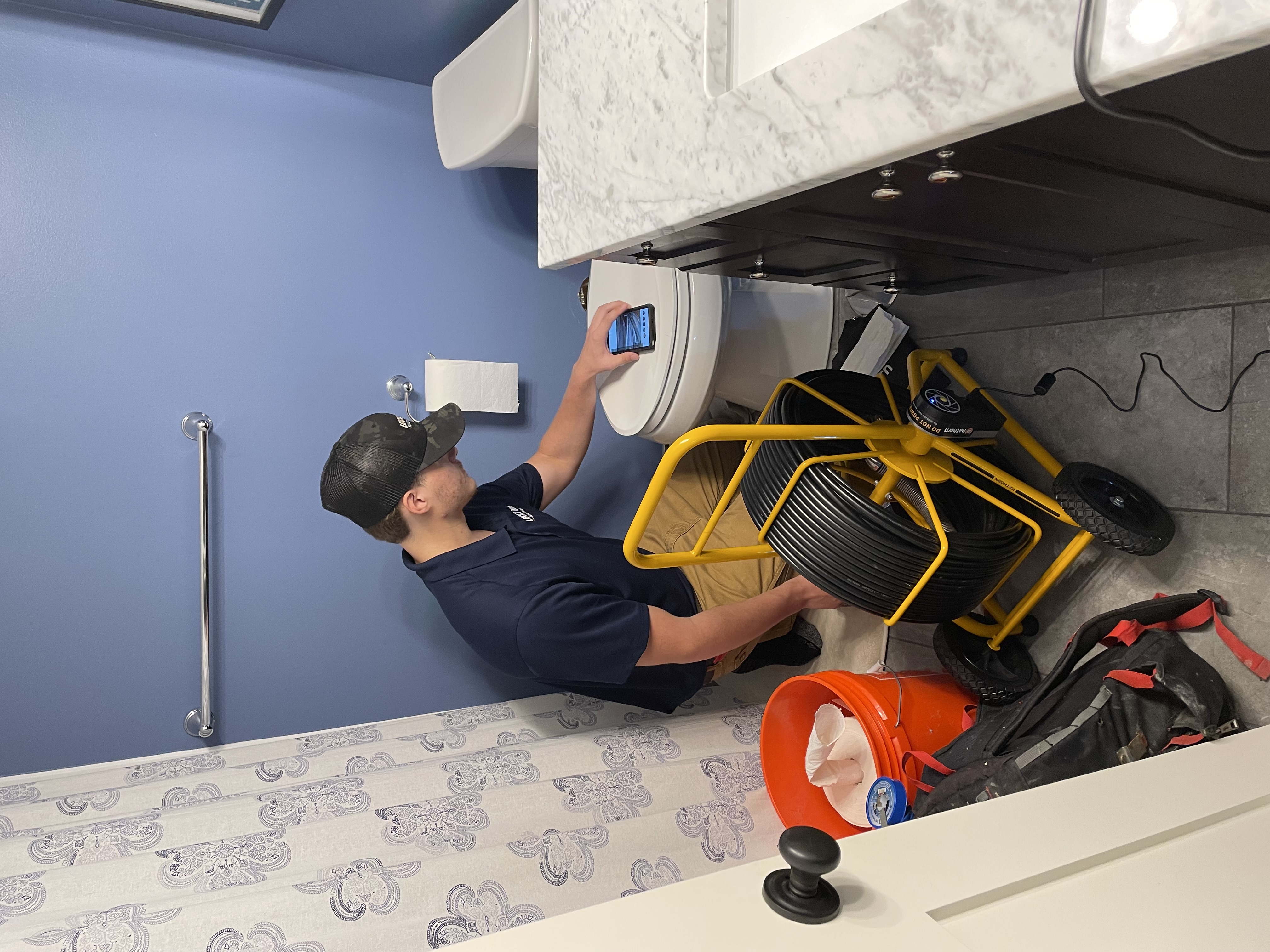 Drain technician running a sewer camera inspection in Bloomington, MN
