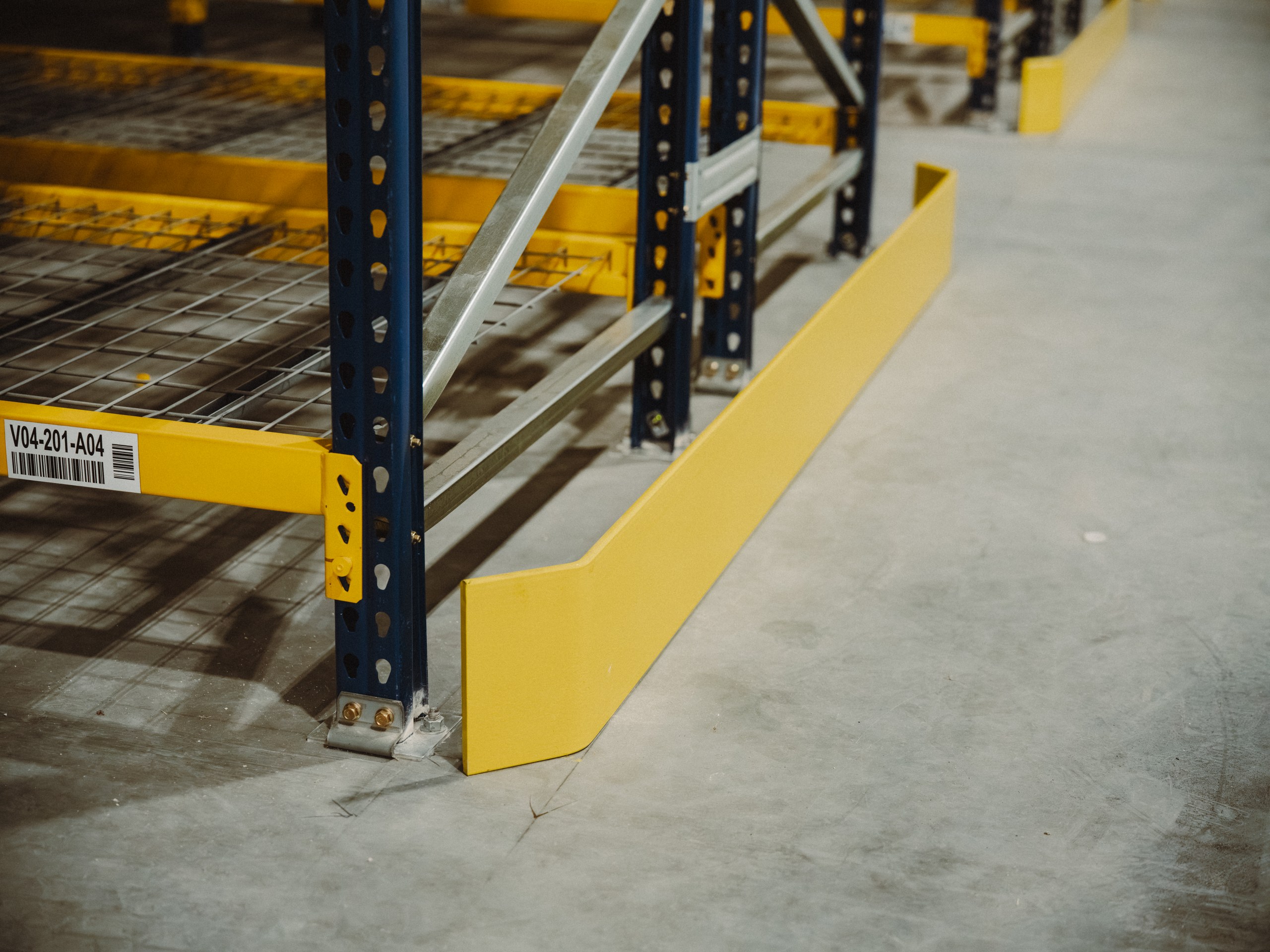 End of aisle guard and upright base on a completed Optum Group racking install