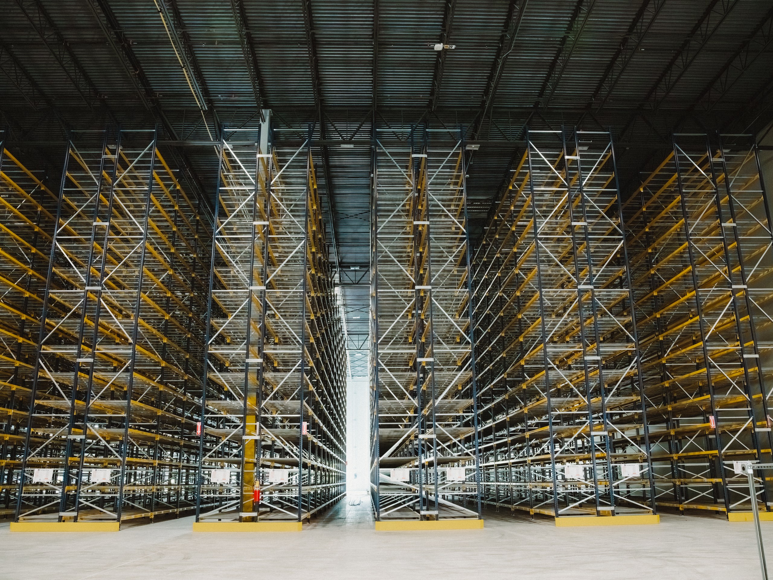Wide view of a completed Optum Group racking installation with aisles converging