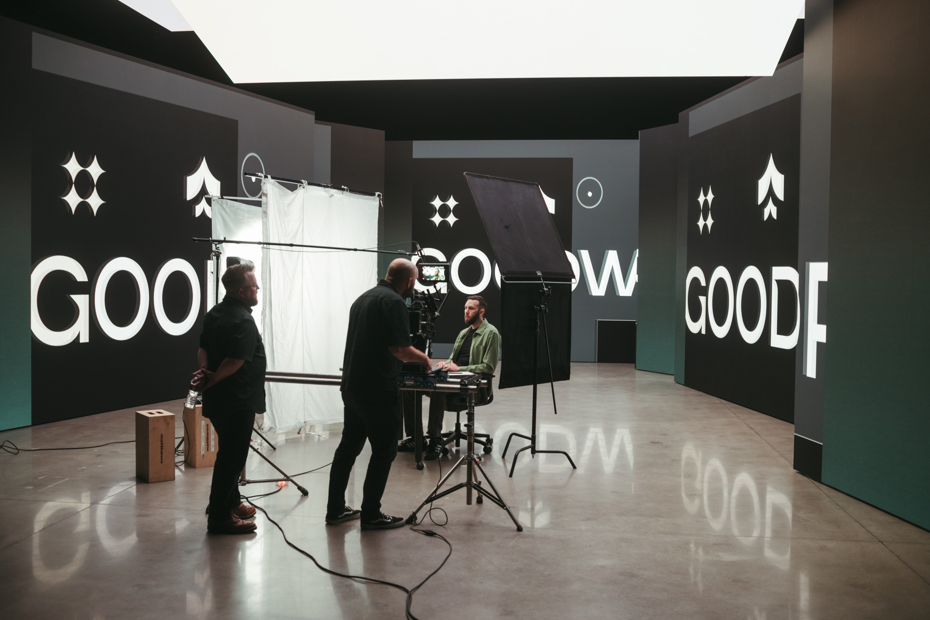 Crew preparing a set inside the Good Word branded studio