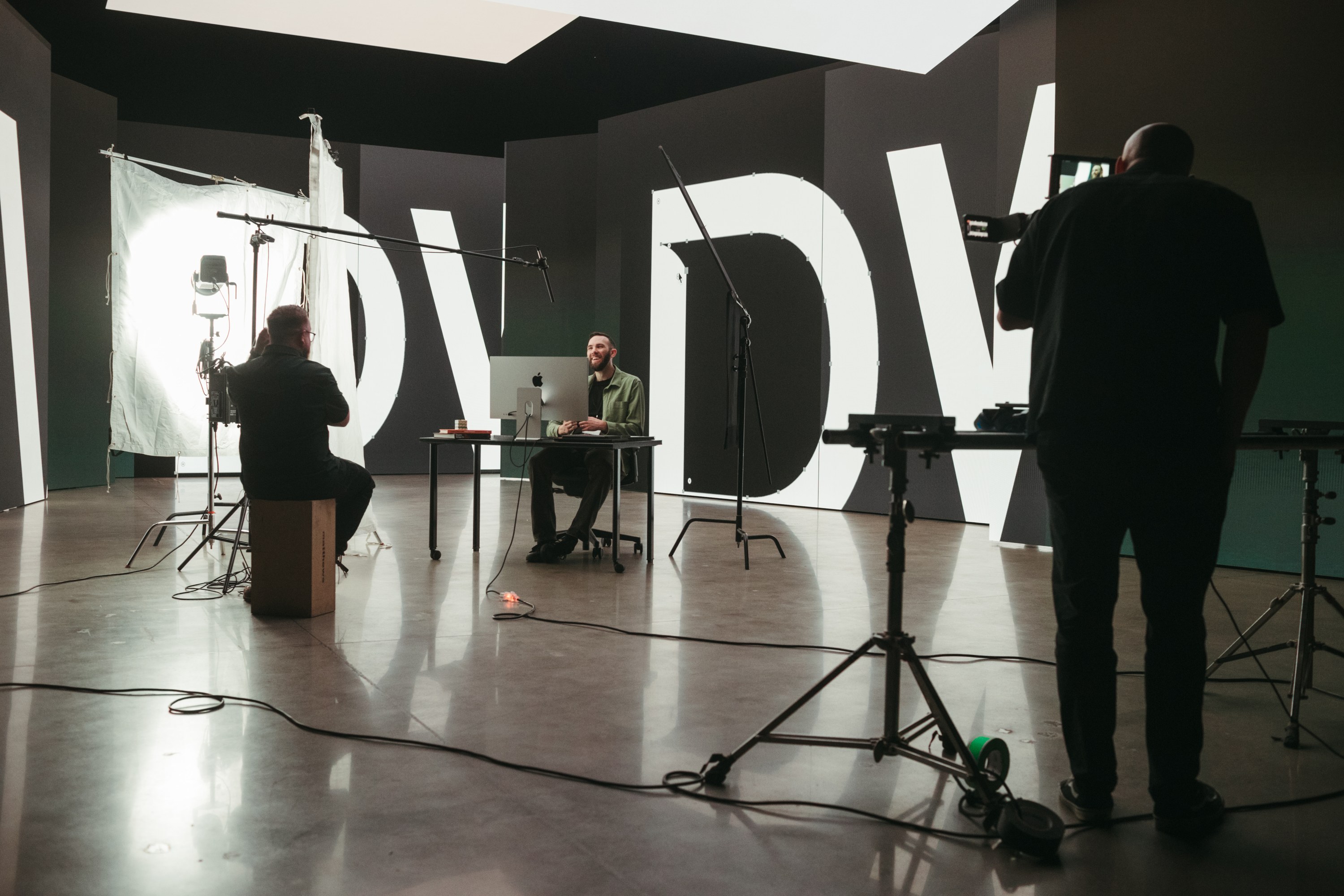 Wide view of a Good Word film set with crew and interview subject