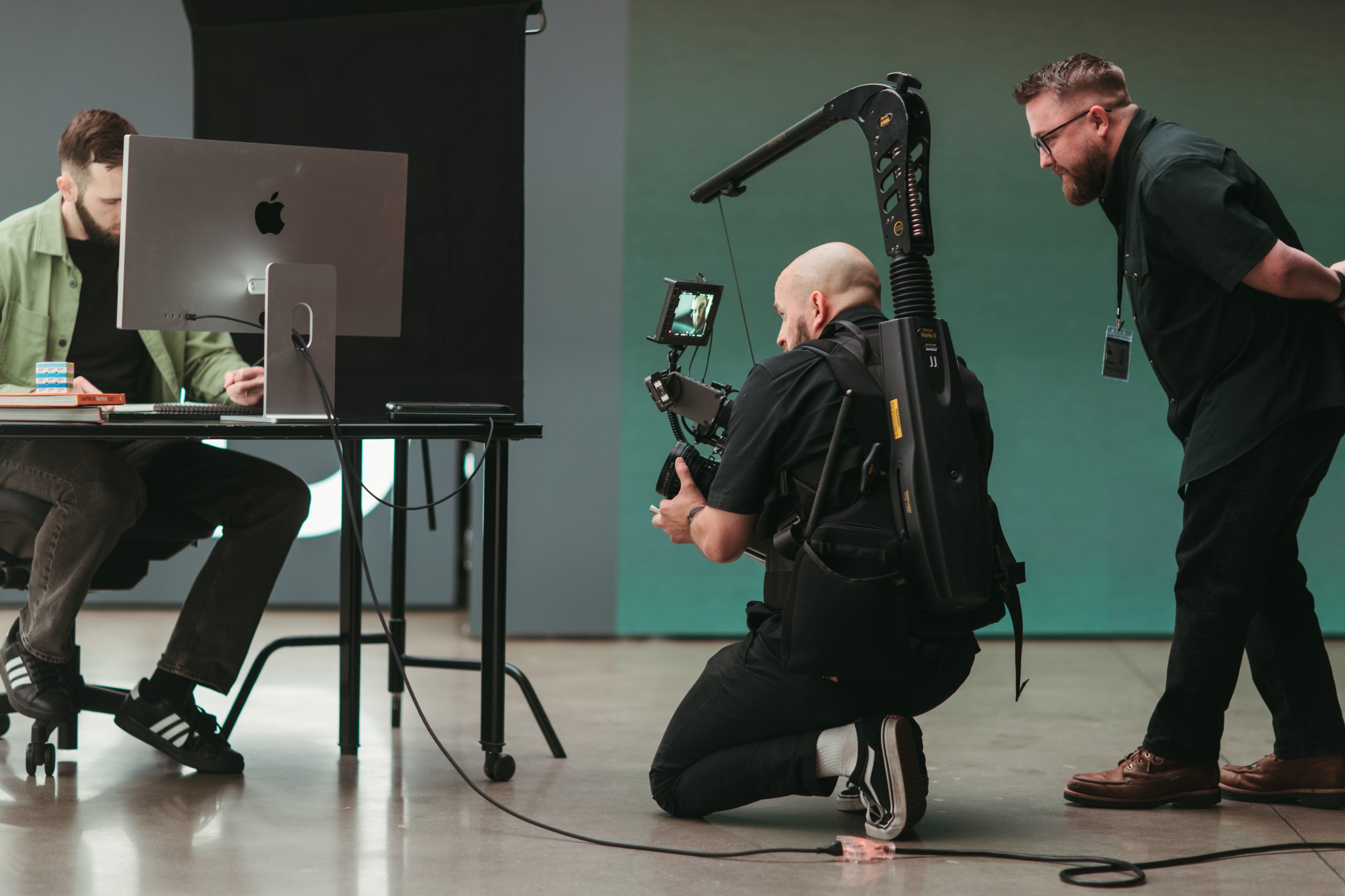 Camera operator and director framing a shot
