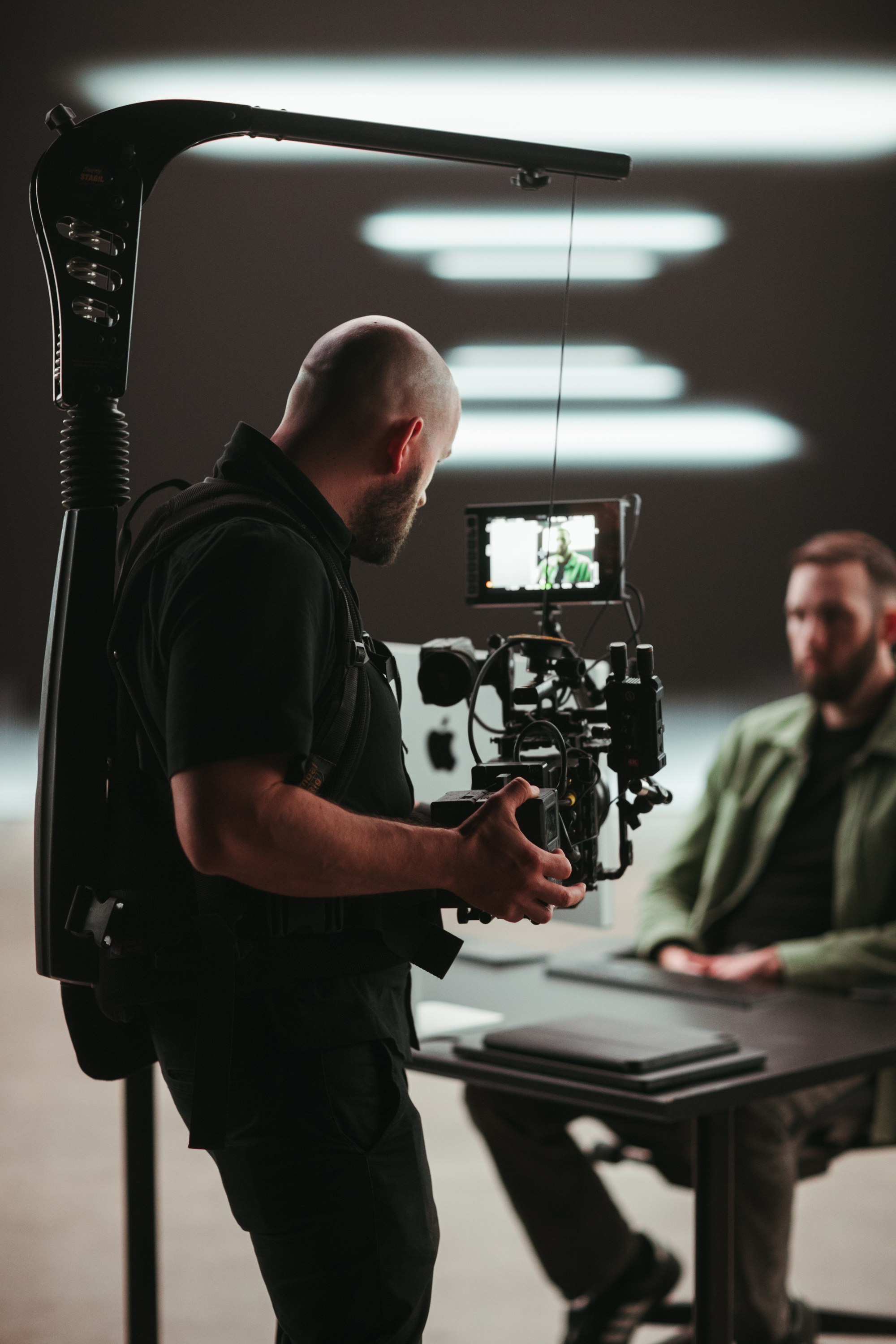 Steadicam operator reviewing a shot on the monitor