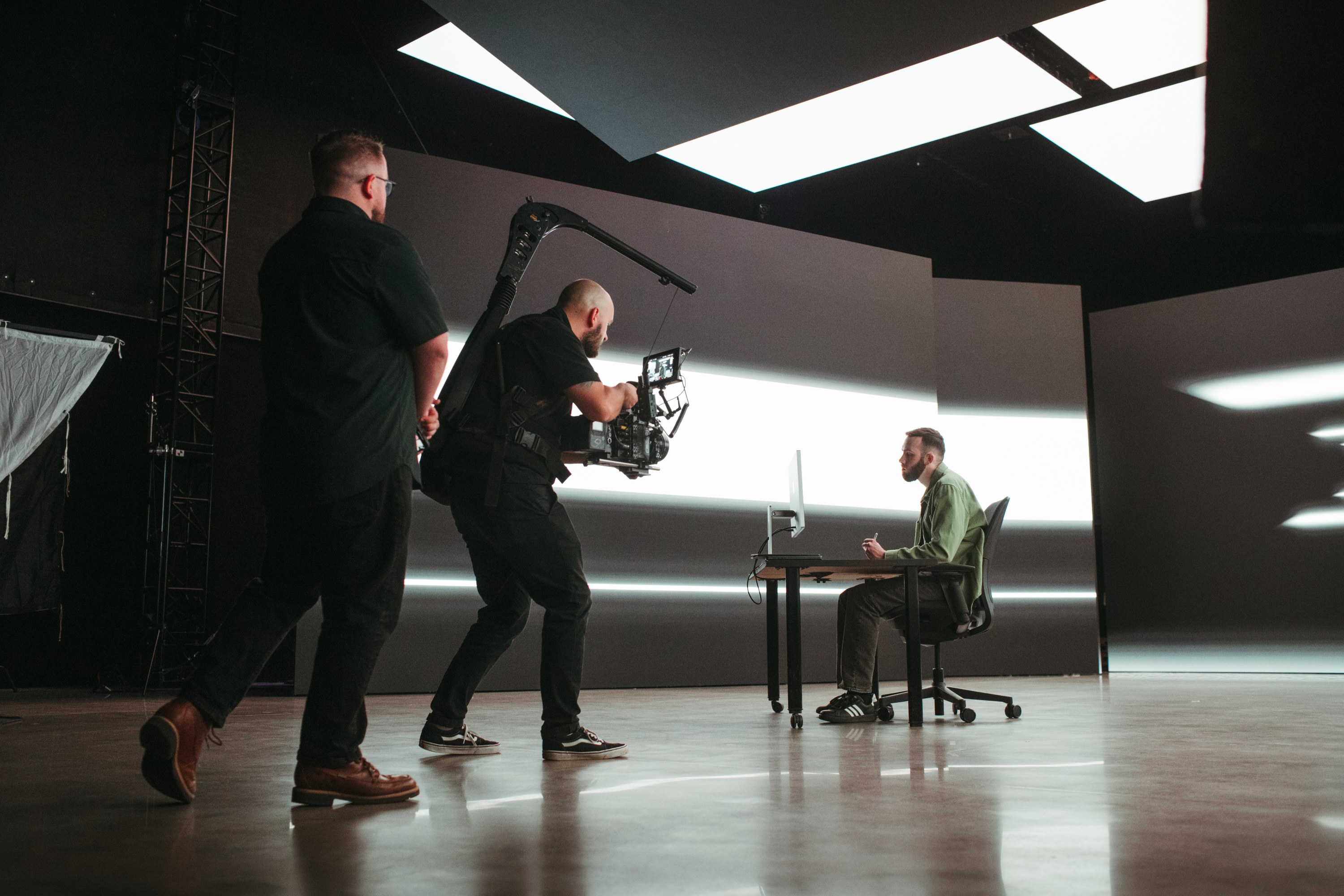 Crew moving through the studio during a take