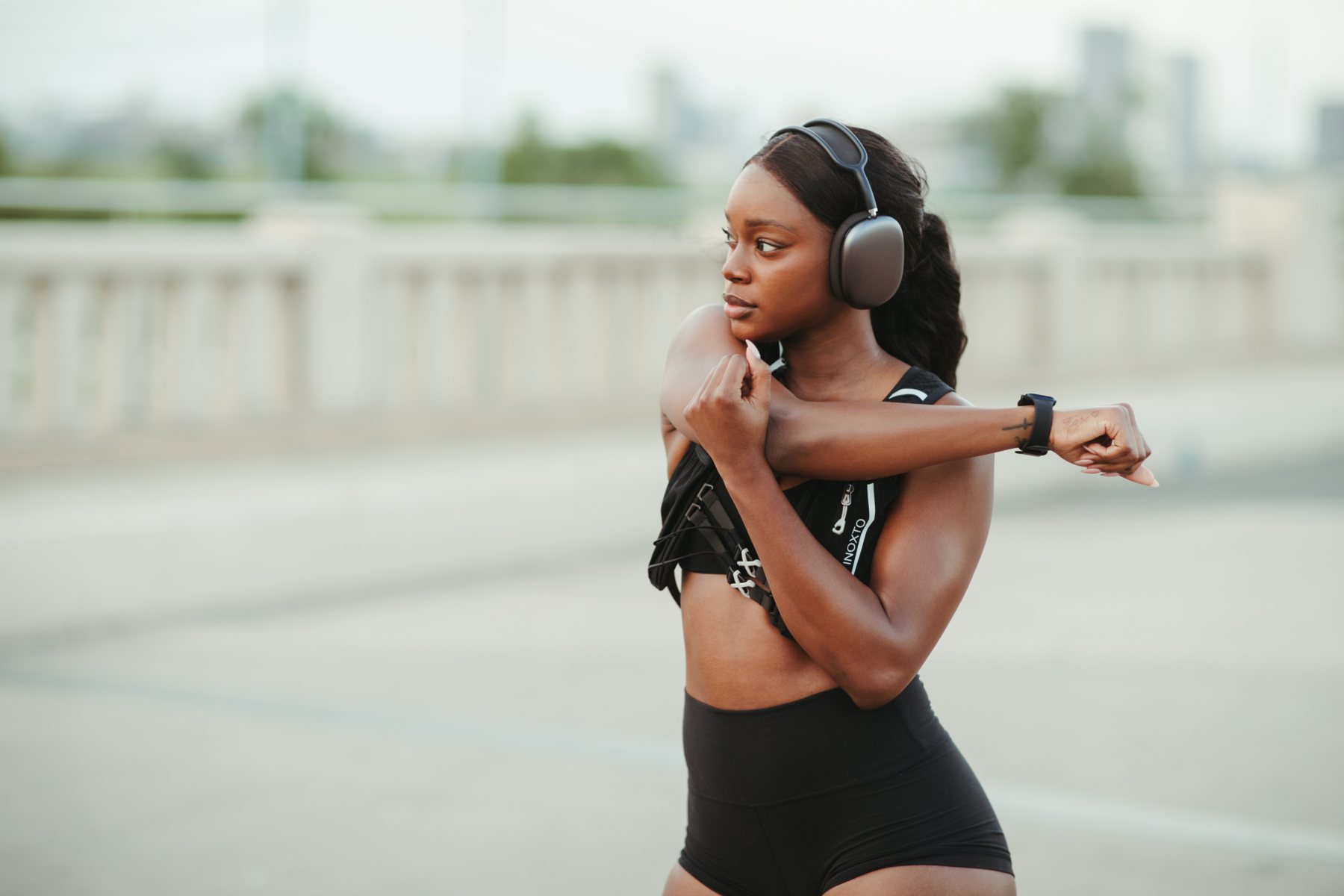 Runner stretching outdoors before a workout