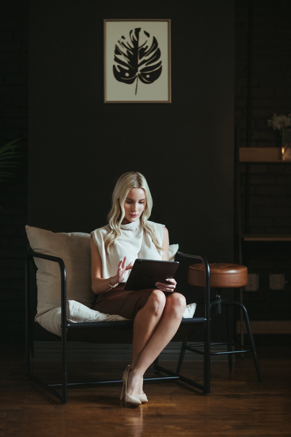 Woman reading a tablet in a lounge chair
