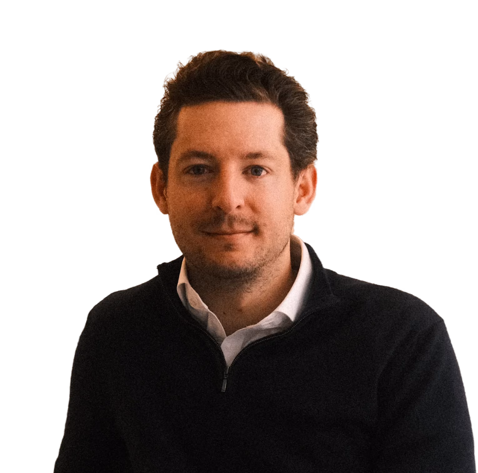Portrait photo of a man in a dark sweater smiling for a professional headshot.